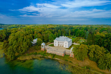 Fototapeta na wymiar Aerial drone view shot of Uzutrakis Manor in Trakai Galve lake, Lithuania during daylight in autumn