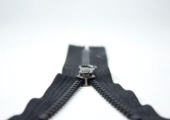 Zipper on a white background. Close-up of a zipper.