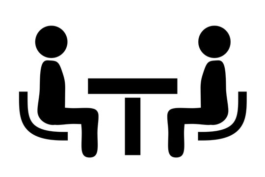 A consultation icon of two people sitting across a table, facing each other and talking.
