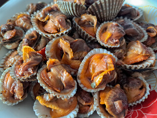 Seafood, boiled scallops that are peeled and stacked together