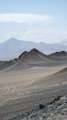 landforms of black mountain peaks which are like moon surfaces.