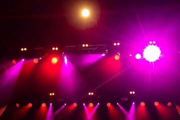 Colorful concert lights on empty stage