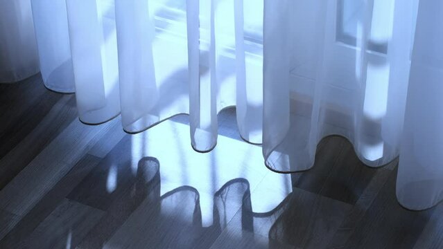 Romantic Twilight Interlude: The sensuous movement of a sheer curtain in the late evening air casts a soft spell of light and shadow across the room