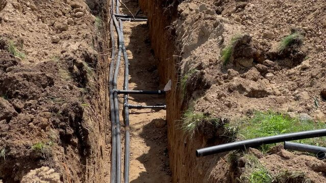 Plastic pipes laid in trenches
