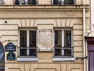 Plaque pointing the building in which playwright Moliere lived and died in rue Moliere, Paris city centre, France