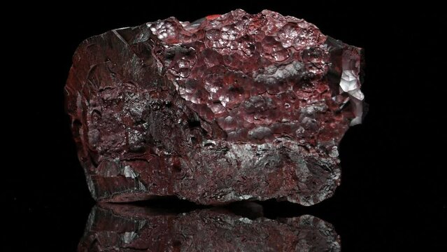 Hematite / Haematite (principal ore of iron) 'kidney ore' - sample rotating slowly against a black background.