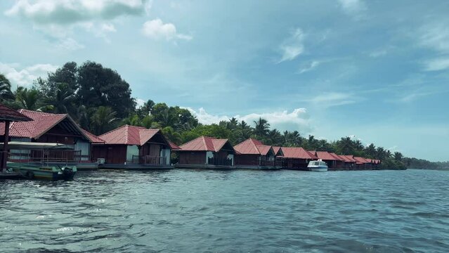 boat view of the tropical island in Kerala, India, luxurious resorts on sea side