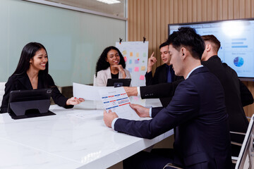 Multi-Ethnic Businessperson Presenting Diverse Entrepreneurs Talking Using TV with Infographics