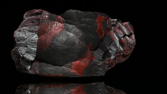 Hematite / Haematite (principal ore of iron) 'kidney ore' - sample rotating slowly against a black background.