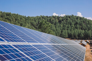 Solar panels on a mountain. A view of the solar panel with the mountains in the background,Solar...
