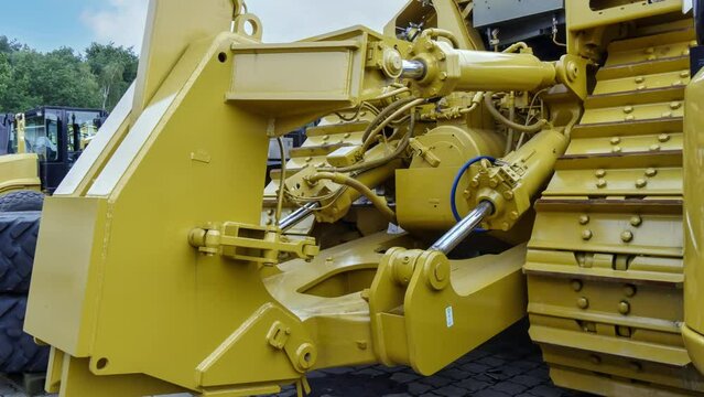 New tracked dozer with attached ripper for working.