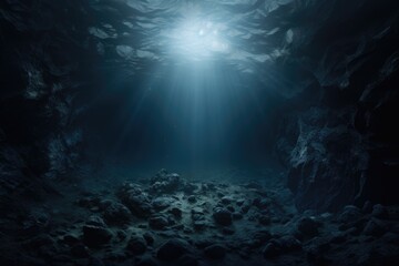 A picture of a dark cave with a beam of light shining through the water. This image can be used to depict mystery, exploration, or the beauty of nature.