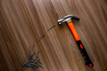 hammer and nails on wooden background