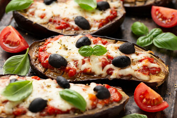 Healthy Eggplant or Aubergine pizza with tomato sauce, mozzarella cheese, basil and olives