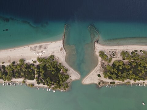 Overhead drone photo over the rocks and the tropical blue ocean of Paliouri n Halkidiki, Greece