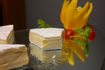 White gouda cheese is placed