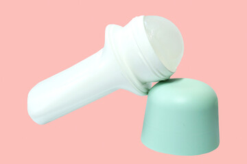Roll-on deodorant on pink background