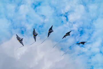 Multiple exposure of a fighter jet rolling over
