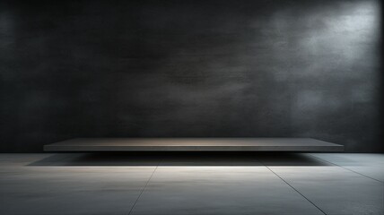 An empty sleek black surface with subtle texture, creating a minimalist environment