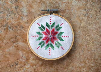 Details of handmade cross-stitch and wooden decoration for Christmas. - 655311673