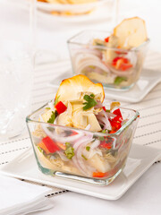 Delicious artichoke ceviche, typical Ecuadorian dish served with yucca chips. close up photography