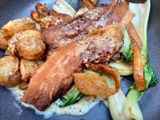 roast pork belly with potatoes cabbage carrots with cream sauce