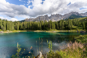 Carezza lake on a sunny day, Italy. - 655327842