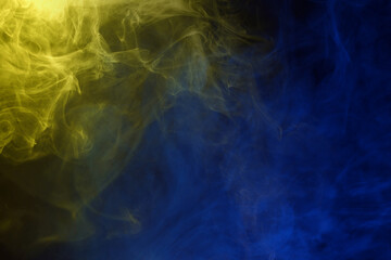 Yellow and pink steam on a black background.