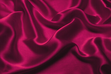 Red silk or satin luxury fabric texture can use as abstract background.