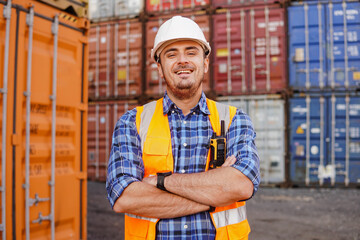 Portrait of smiling container man worker in container warehouse. Import and export shipping....