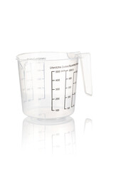 Plastic kitchen measuring cup on isolated white background. Close-up