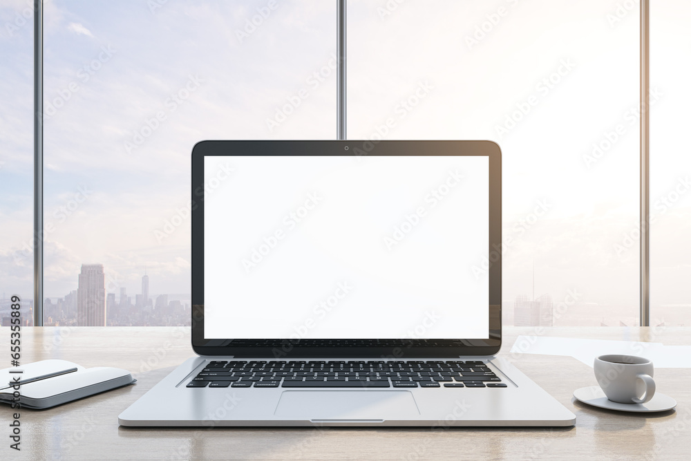 Poster close up of modern wooden desktop with empty white mock up laptop screen, supplies, coffee cup and p