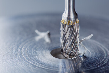 Milling cutter make sink in hole in steel billet. Locksmith work.
