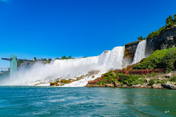 View on the Bridal Veil Falls and American Falls of the Niagara Falls, the part of Goat Island, the Cave of the Winds Lookout, stairs and platforms, wooden walkways, Niagara Falls, New York, USA High