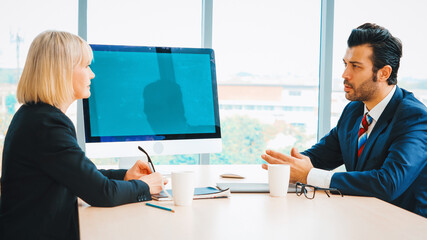 Business people in the conference room with green screen chroma key TV or computer on the office...