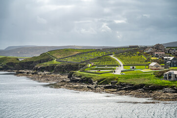 Shetland Islands Cityscape and old graveyard with sea in front, wide angle shot, view from the...