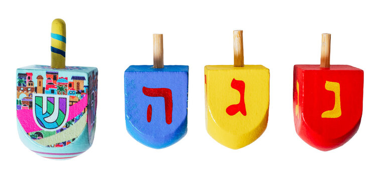 Wooden dreidels for Hanukkah isolated on white or transparent background.