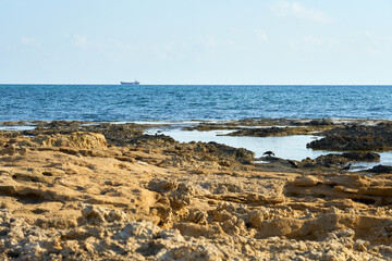 Fototapeta na wymiar The stone coast of the Mediterranean Sea in Cyprus.