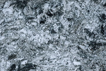 Background, texture of burnt firewood ash. Photo, top view.