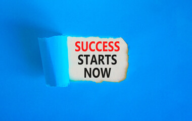 Success starts now symbol. Concept word Success starts now on beautiful white paper. Beautiful blue...