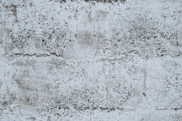 Gray stained concrete wall, dirty cracked cement surface close-up. Photography, abstraction, background.