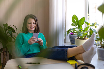 Happy young woman rejoicing over victoring on internet, completing project, done or new job, success, winning online lottery, finishing mortgage. Female millennial glad at computer in home office