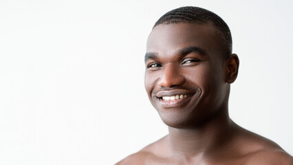 Man skincare. Hygiene treatment. Happy handsome shirtless guy with soft smooth clean face skin...