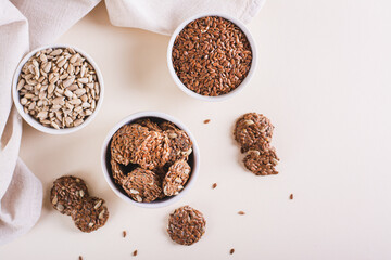 Crispy baked bread from flax and sunflower seeds in a bowl on the table top view