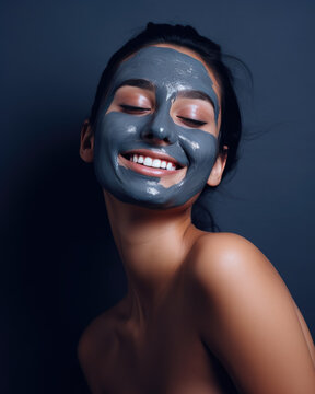 portrait of a woman wearing a dark blue mask for skincare, sensuality pose on a plain background, beauty model whit cosmetics 