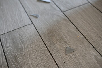 pieces of broken glass on the tile