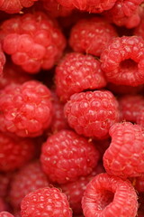 red raspberries close-up, macro juicy ripe raspberries