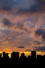 Pink Clouds At Sunset or Sunrise Above an Urban Silhouette.