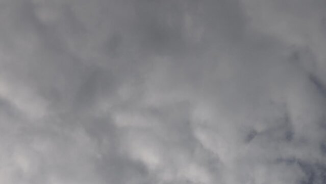 timelapse video with white clouds running on sky. cloudscape with white cumulus clouds