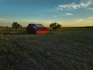 Texas Flag painted barn at sunset © A Beautiful World